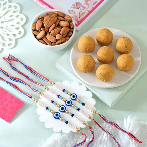 Brothers Charm Set: 4 Evil Eye Rakhis with Sweets & Nuts