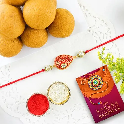 Elegant Kundan Rakhi and Besan Ladoo Combo