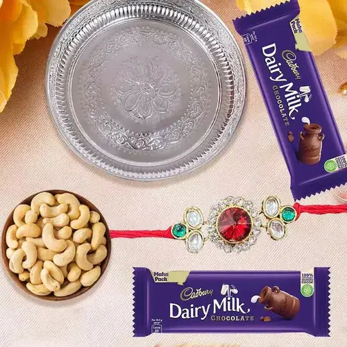 Admirable Rakhi Special Gift of One Silver Puja Thali with One Fancy Rakhi and Spicy Cashew Nuts