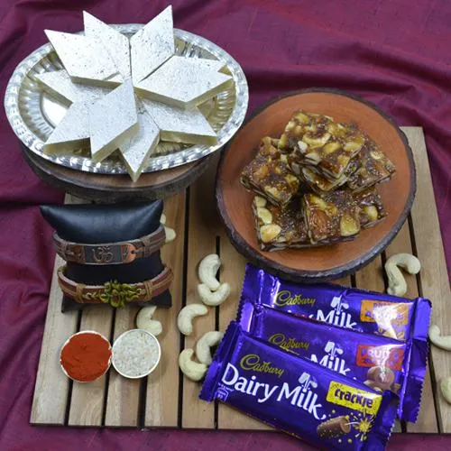 Pious Om Rakhi with Puja Tray, Haldiram Sweets N Cadbury Chocolates